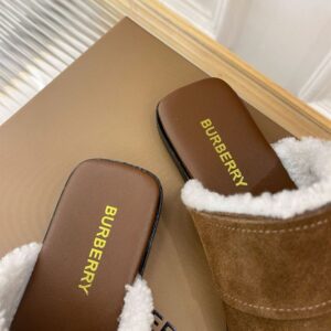 BURBERRY MONOGRAM DETAIL SHEARLING-LINED SUEDE MULES - U019