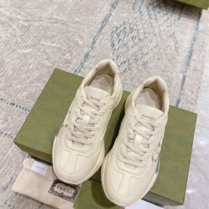 GUCCI RHYTON GUCCI LOGO LEATHER SNEAKER - G111