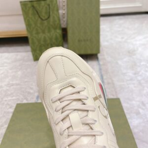 GUCCI RHYTON GUCCI LOGO LEATHER SNEAKER - G111